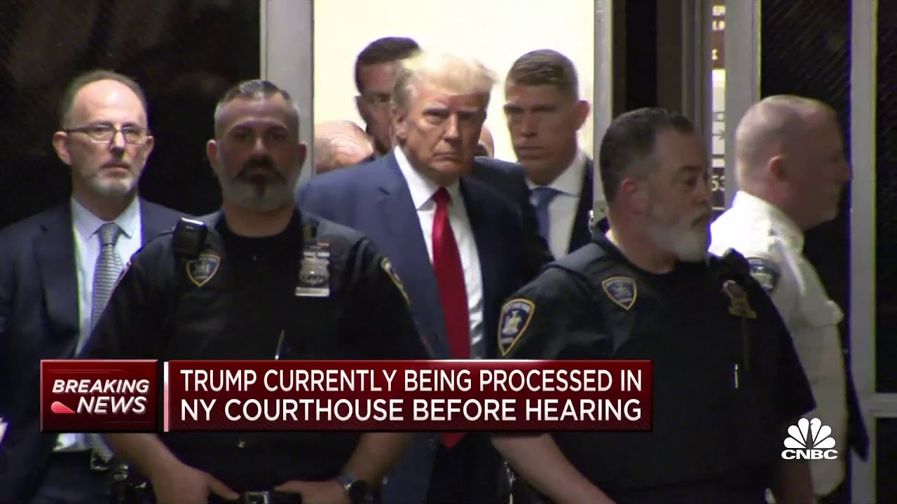 Donald Trump enters New York City courtroom following arrest processing