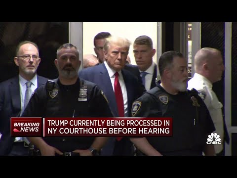Donald Trump enters New York City courtroom following arrest processing