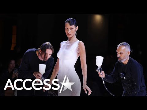 Bella Hadid Gets Dress Spray-Painted Onto Her Mid-Fashion Show