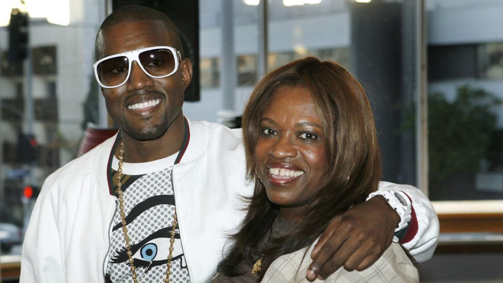 Kanye with her mom Donda