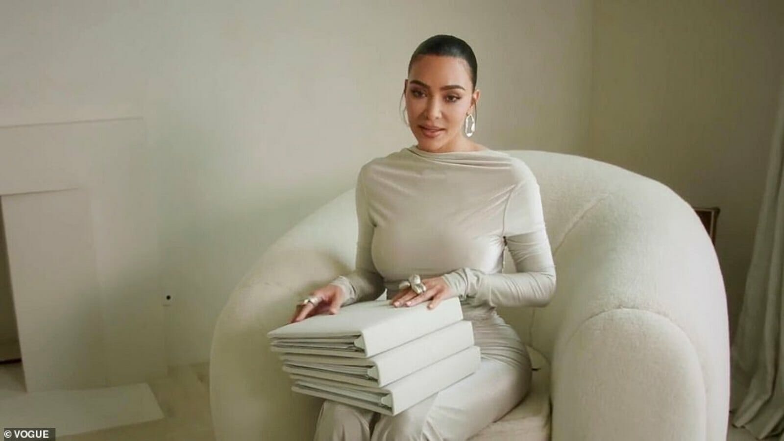 Kim in her sitting room with the kids' books.