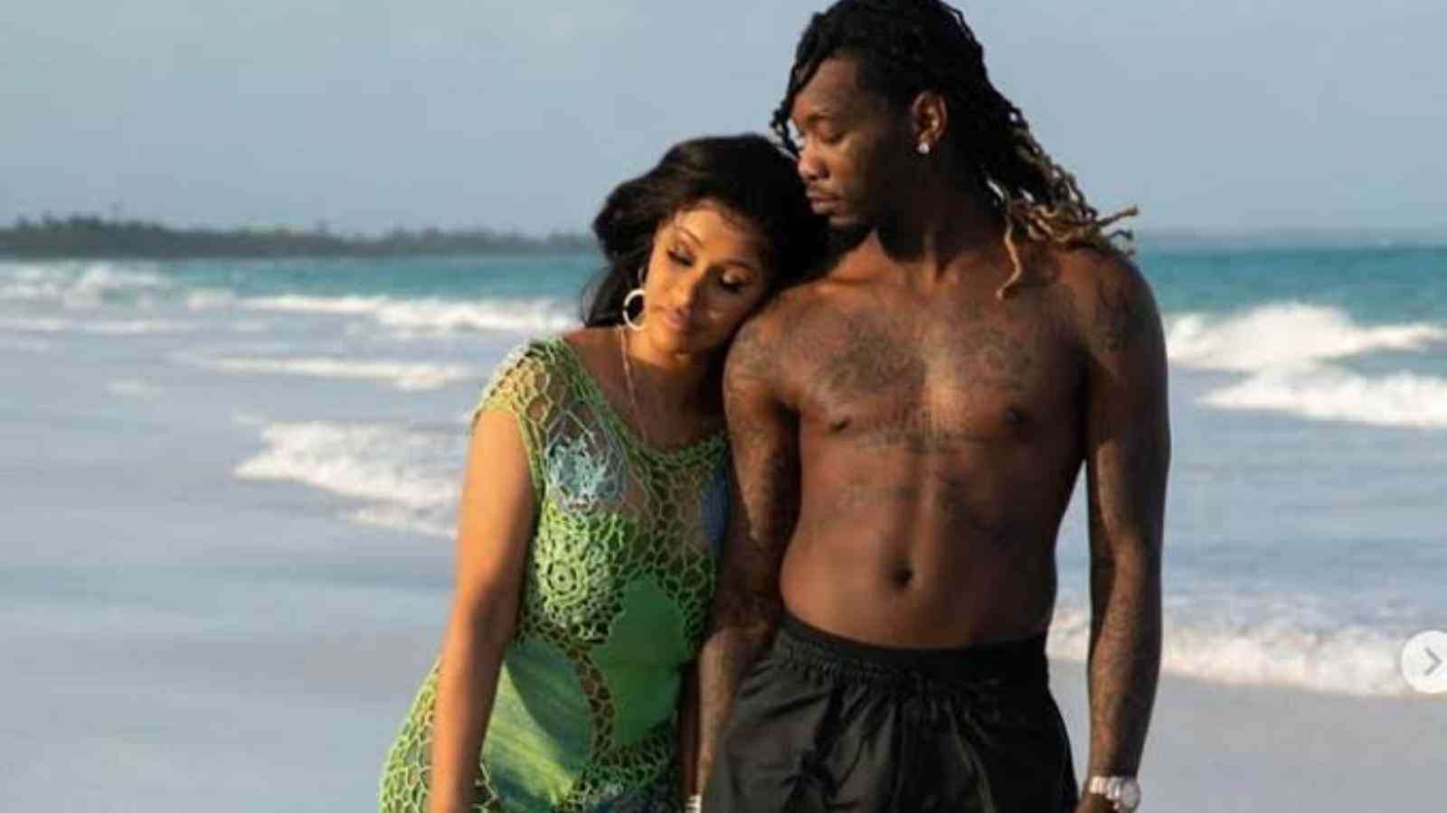 Cardi B and Offset walking along the beach
