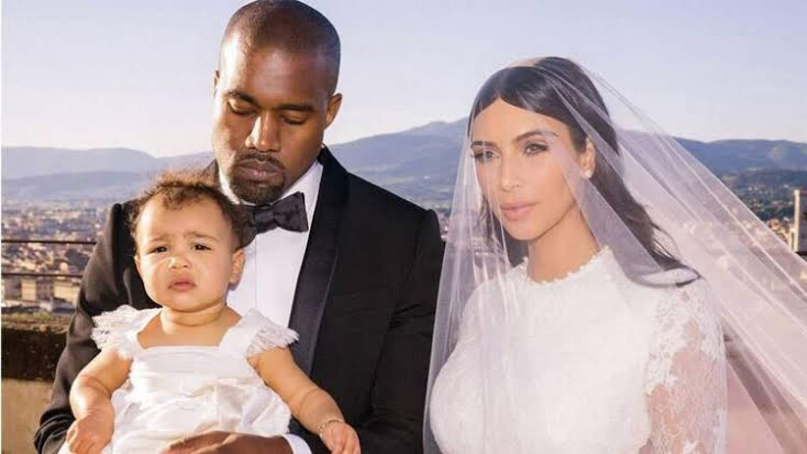 Kanye West and Kim Kardashian with North West during their wedding day